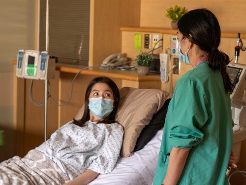 Nurse and patient talking.